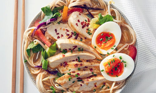 A steaming bowl of comforting Ramen Classic Plate with vegetables
